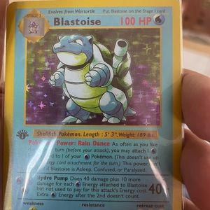Blastoise 1st edition holographic Pokémon card.